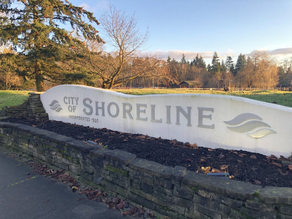 City of shoreline logo in white color along with a greenery